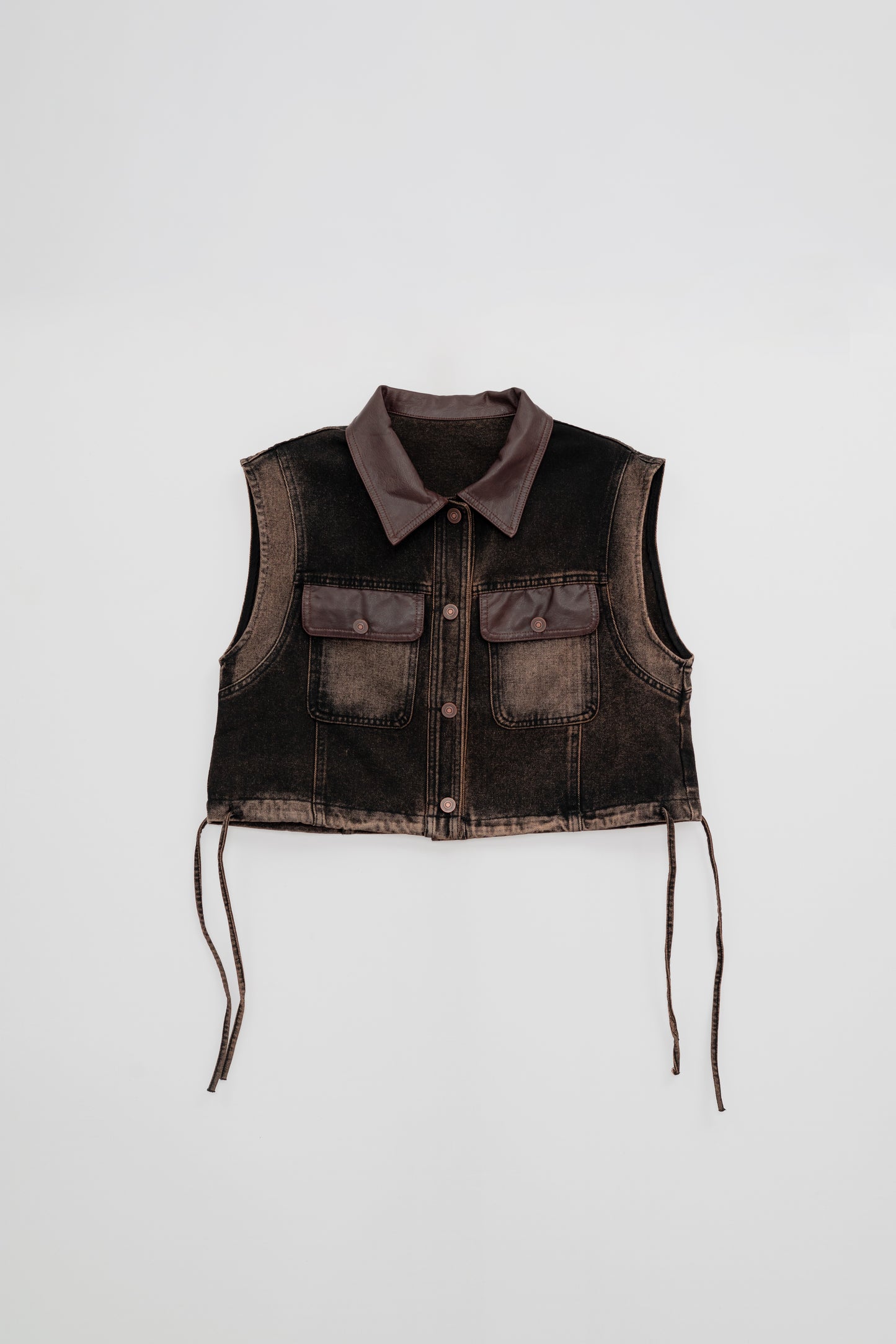 Washed Denim Vest with Leather Details .