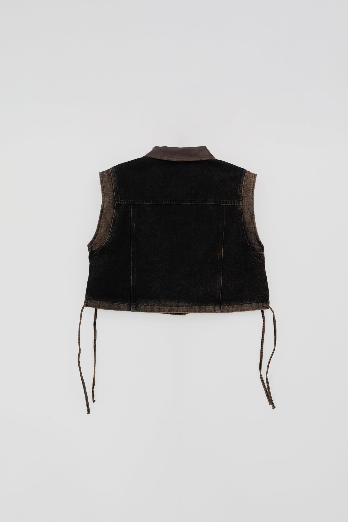 Washed Denim Vest with Leather Details .