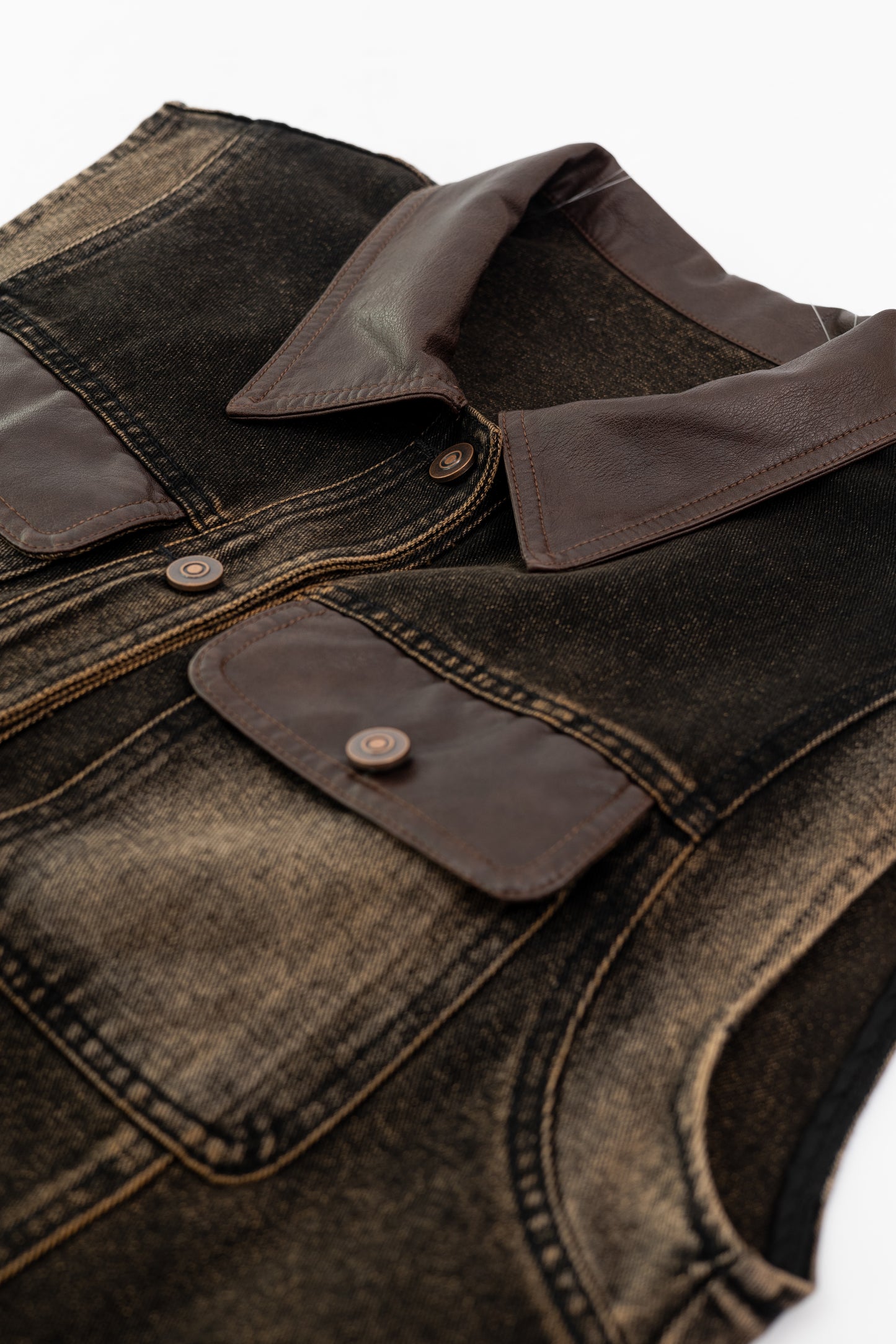 Washed Denim Vest with Leather Details .