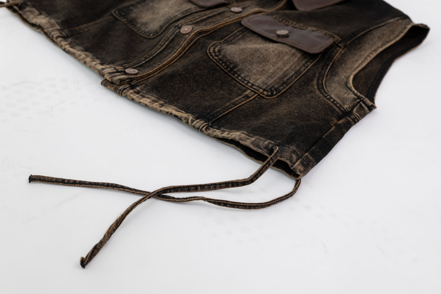 Washed Denim Vest with Leather Details .