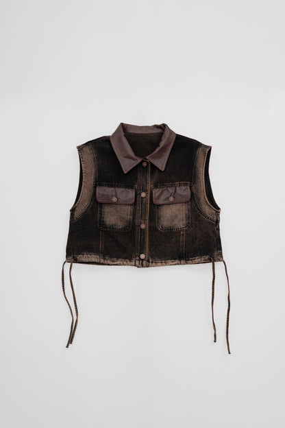 Washed Denim Vest with Leather Details .