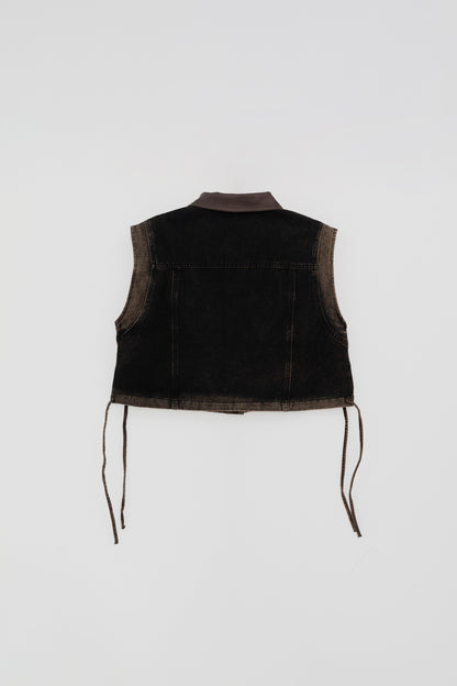 Washed Denim Vest with Leather Details .
