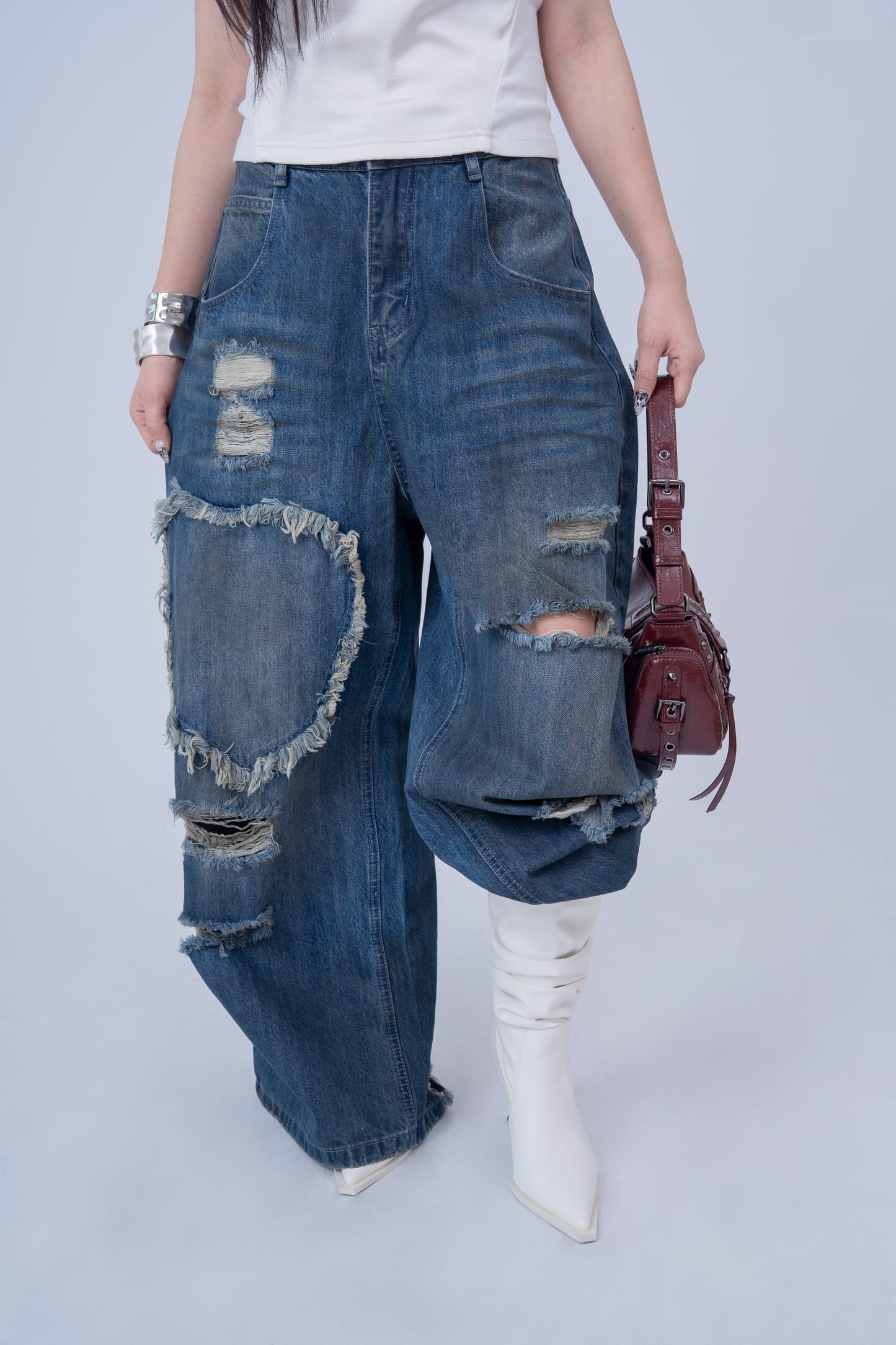 Washed Denim Ripped Baggy Jeans .
