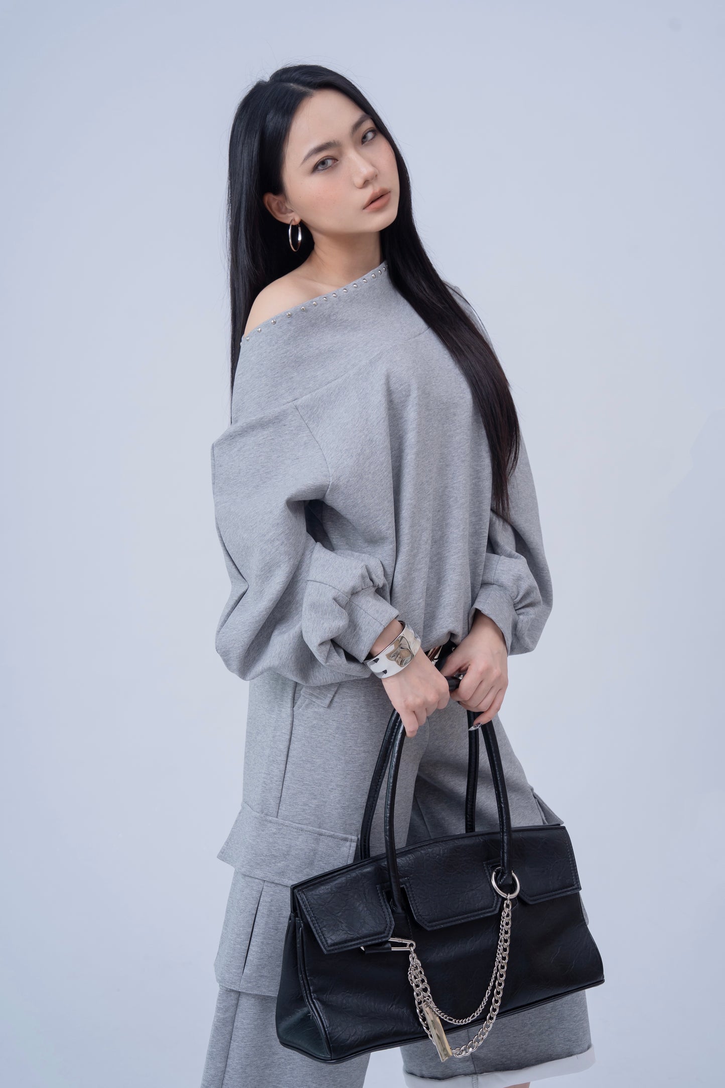 Shoulder Riveted Oversized Long Sleeve Sweater .
