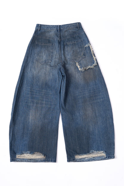 Washed Denim Ripped Baggy Jeans .