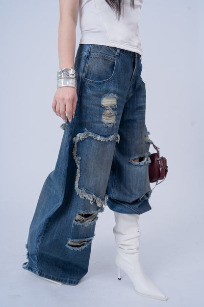 Washed Denim Ripped Baggy Jeans .